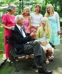 Daughter and granddaughters talking to grandparents