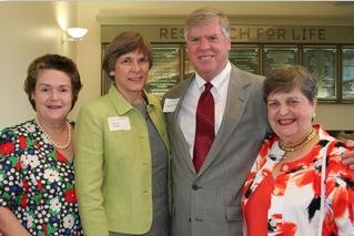 Four Lawrence members posing together