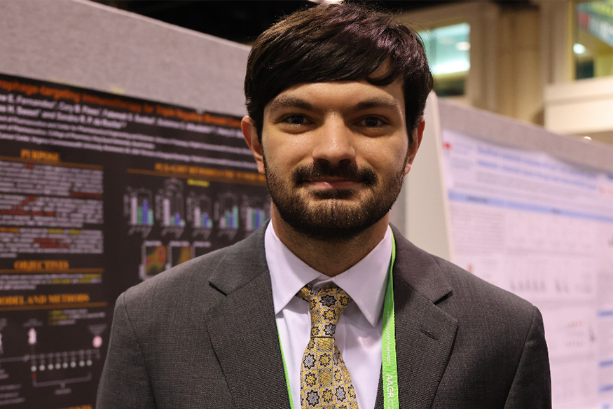 Fernandez pictured at AACR poster session