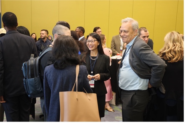 ASCO attendees in discussion at Winn Awards networking reception