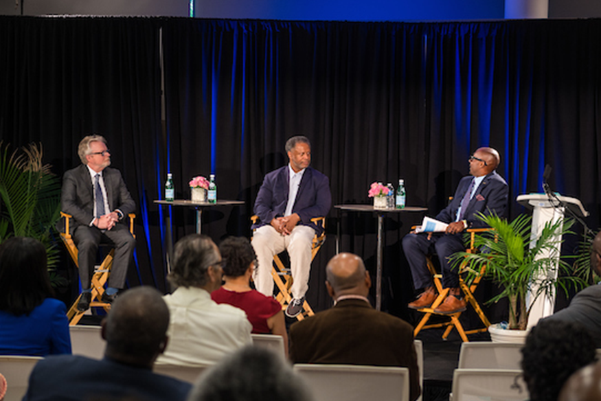 Winn (center) on panel at ESSENCE Festival